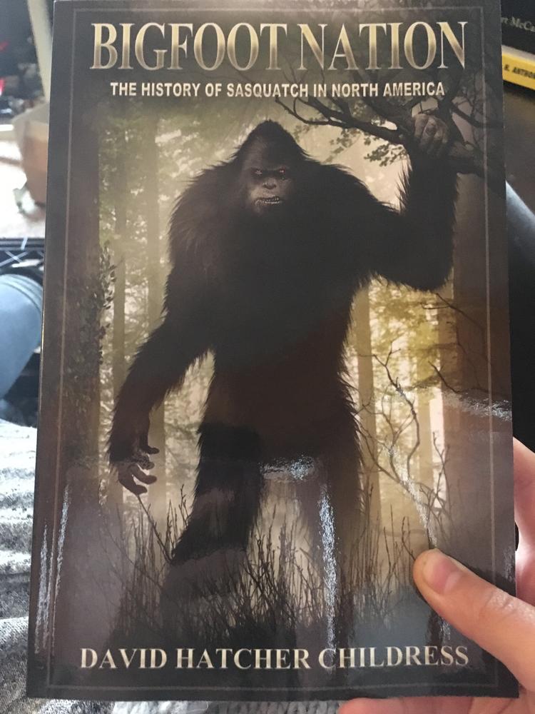 big looming image of hairy wood creature with title along top of book and author along the bottom