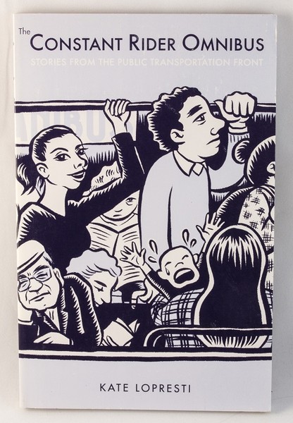 A book with an illustration of people riding a very crowded bus