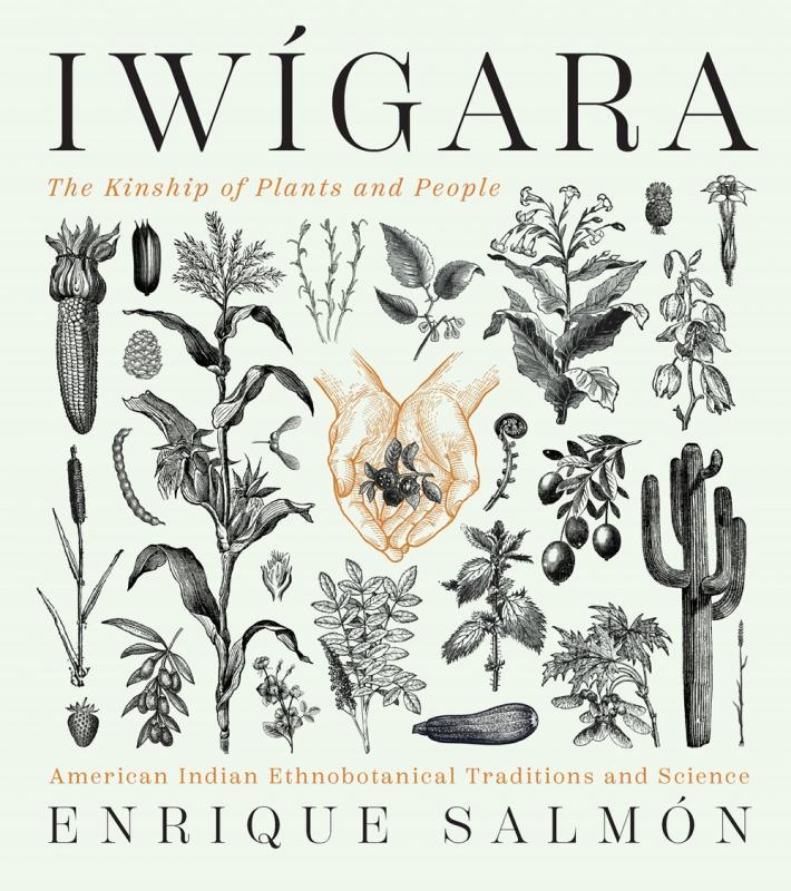 various plants including corn, strawberries, saguaro, zuchini and other dot the cover, with a pair of cupped hands holding a blackberry sprig in the center.