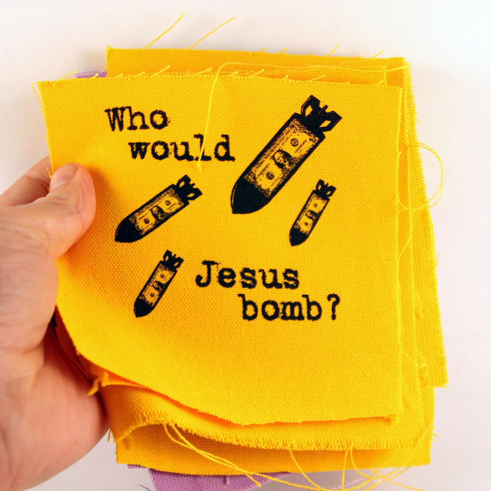 Bombs flying with the text “Who would Jesus bomb?”